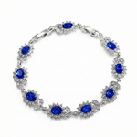 BRACELET TENNIS FLEURS OVALES SAPHIR BLEU HALO PAVÉ | ARGENT